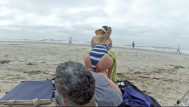 A milf rode a stranger on the beach and received cum in her anus.